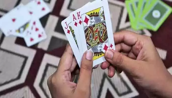 Six arrested in Armour Mamidipalli for gambling; 52 cards, Rs.14,460, and 4 phones seized by police.