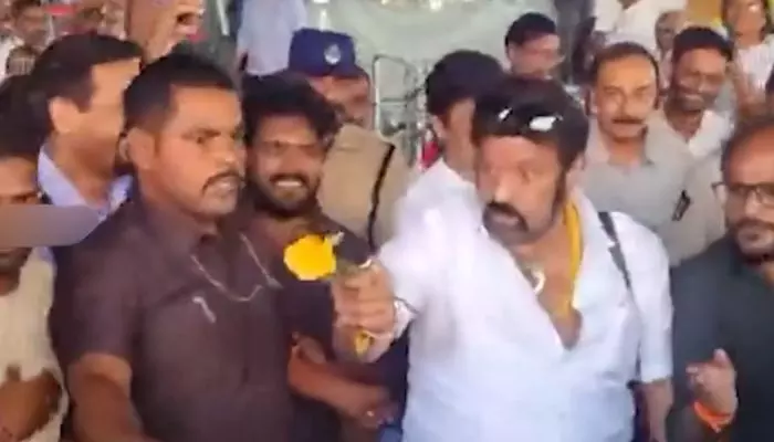 A video of actor-politician Balakrishna scolding a fan at Vizag Airport has gone viral. Netizens are criticizing his harsh reaction.
