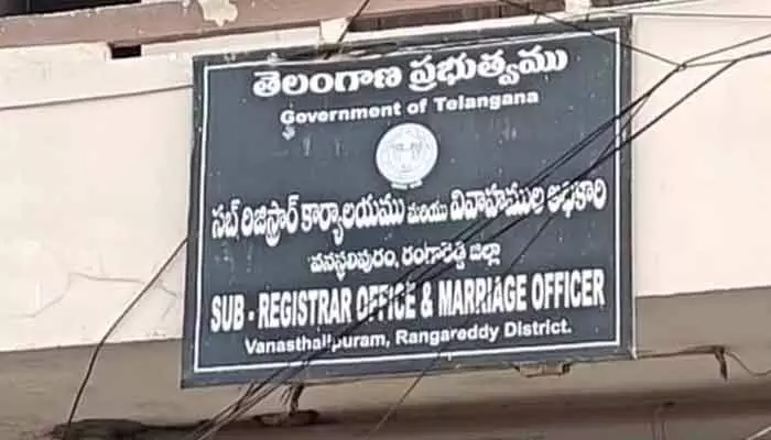Illegal land registrations and corruption surfaced at Vanastalipuram Sub-Registrar office; park land misuse led to officer suspension after inquiry.